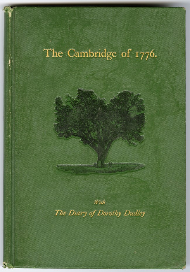 Book with green cover, title in gold, and image of large tree
