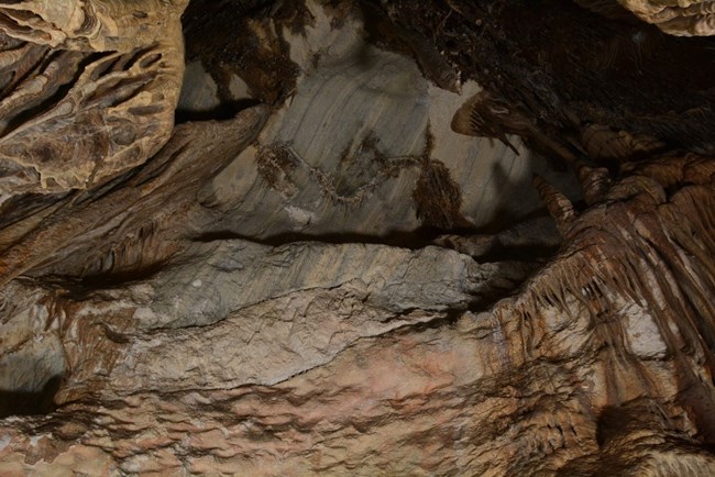 cave wall with stripes going up and down