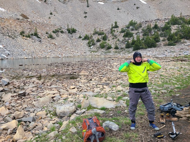 A researcher donning the gear necessary for a snorkel survey in Baker Lake.