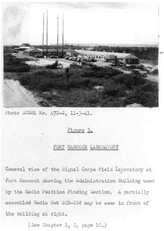 a long, narrow building surrounded by trees