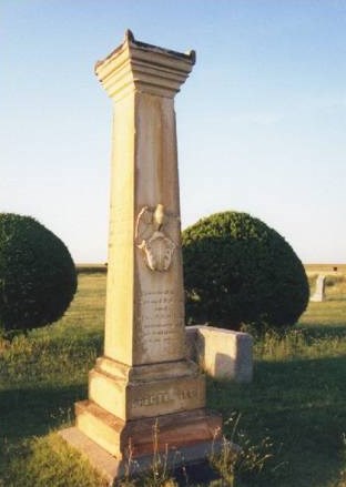 Close up view of  monument shaped like a column.