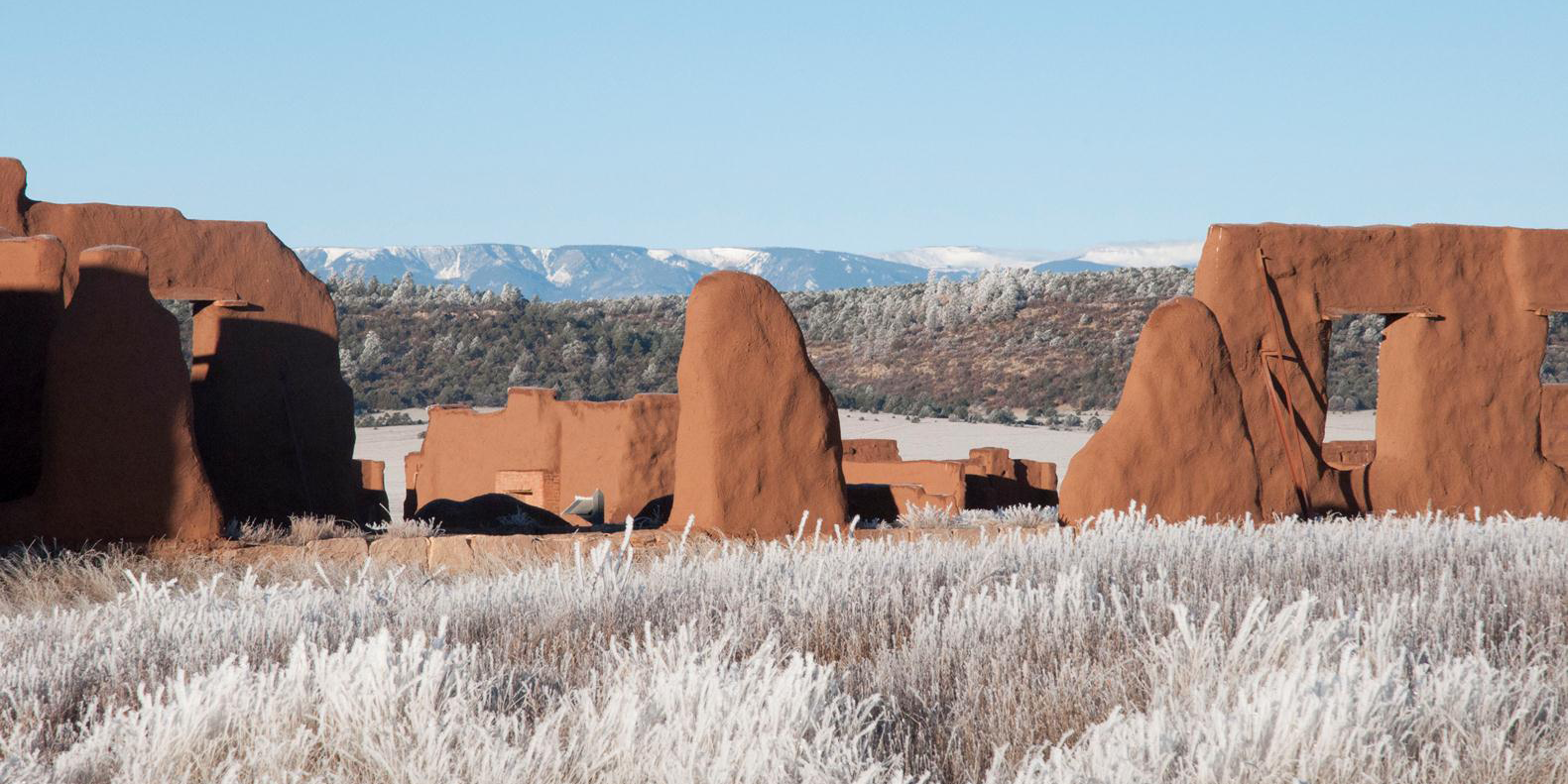 Fort Union adobe ruins in a snowy landscape.