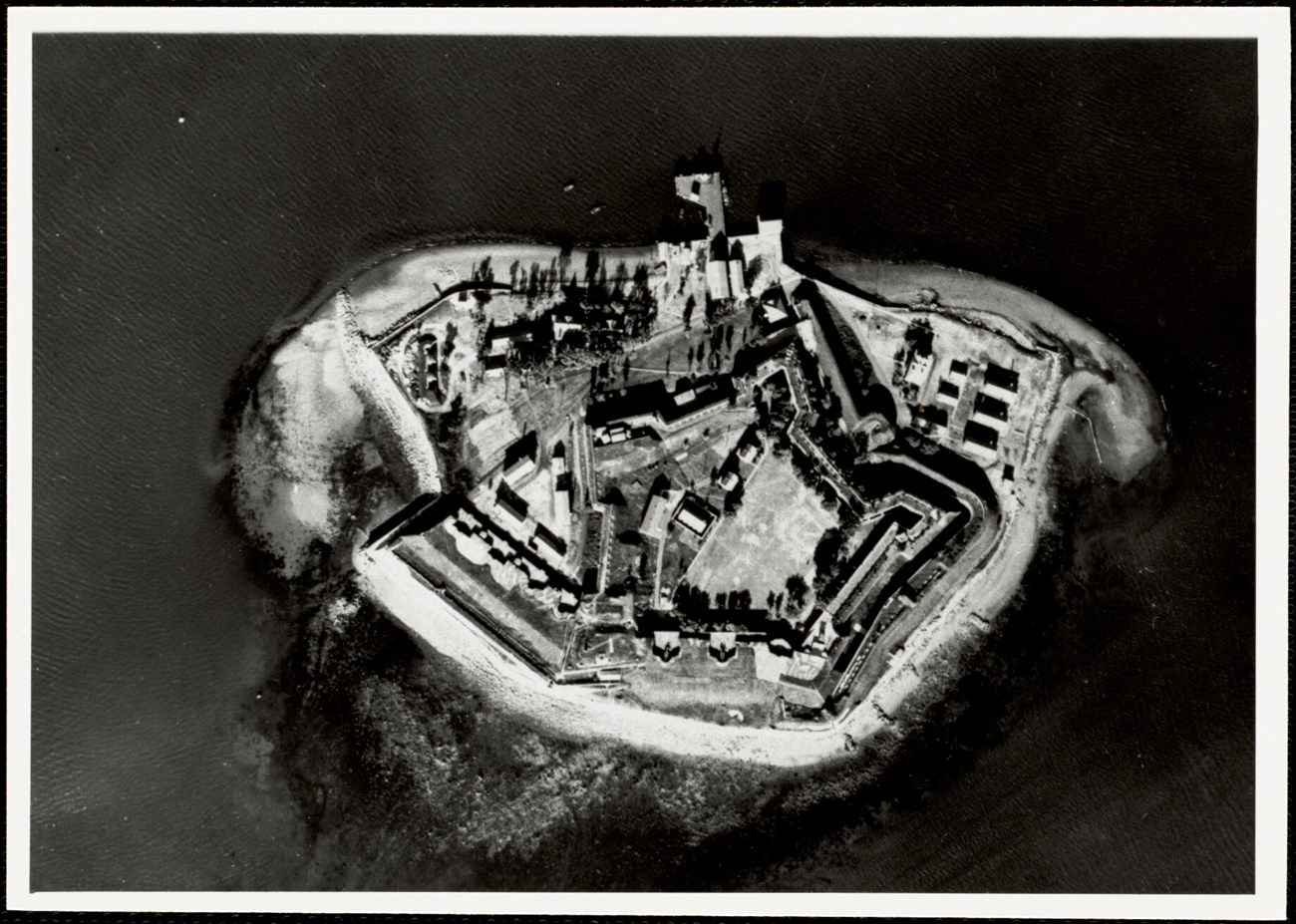 aerial view of fort warren with the star-shaped fort with buildings around it.