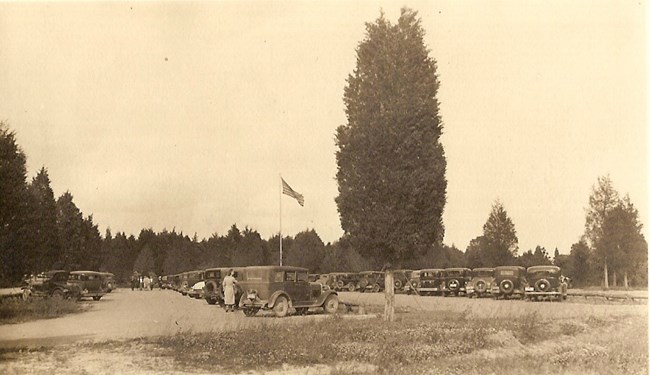 parking lot filled with 1930s cars