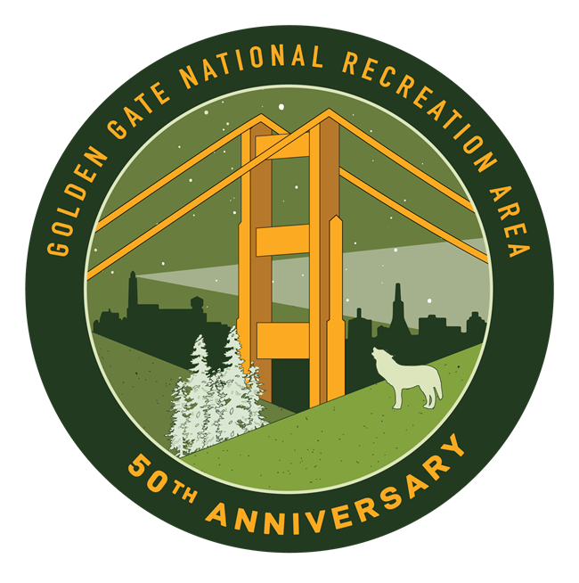 Golden Gate National Recreation Area 50th Anniversary Logo- a wolf howling near coniferous trees in the foreground, top of suspension bridge in front of a city-scape starry night background.