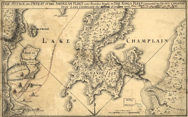 A historic map depicts a section of “Lake Champlain” and several islands within the body of water in black ink on parchment. A large island in the center of the map is labeled “Grand Isle” and several illustrations of ships can be seen in the left side of