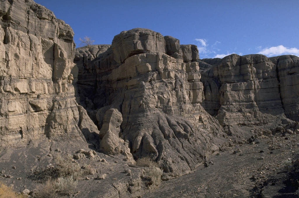 Photo of a tall rocky cliff front