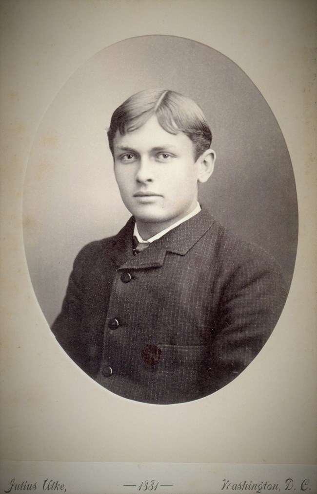 portrait of a young man that is in black and white