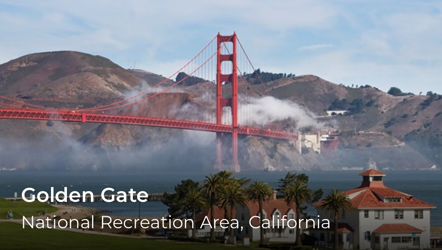 A red bridge spans over fog with hills in the background. On the lower left words say, Golden Gate.