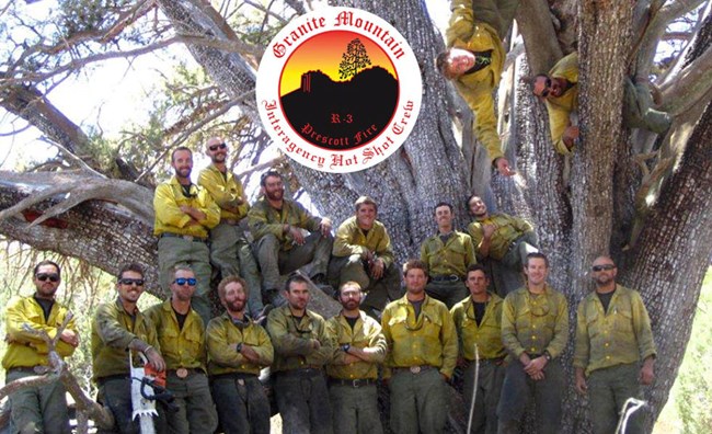 A group photo of 19 firefighters.