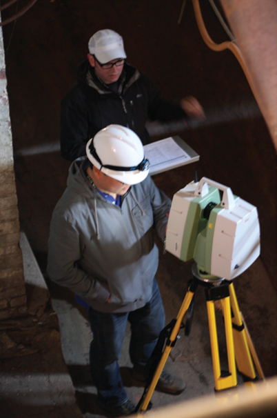 HAER Architect John Wachtel (top) and HABS Architect Daniel De Sousa laser scanning the basement corridor.
