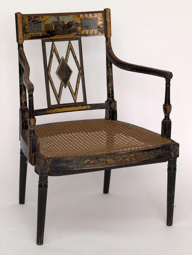 One of the painted chairs in Hampton's collection.
