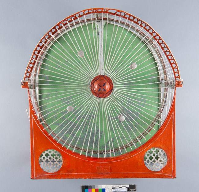 A green backed cage meant for squirrels.