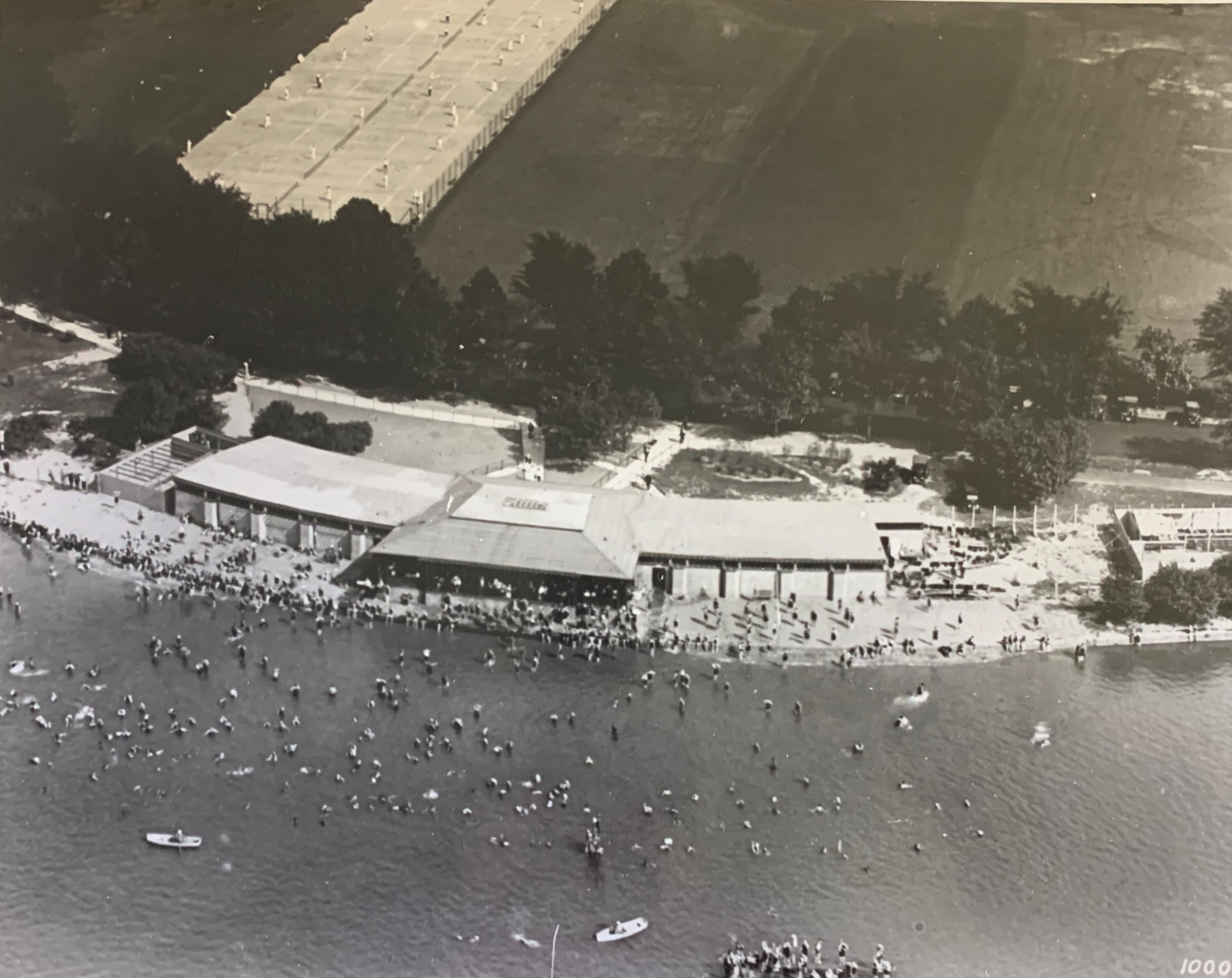 Aerial view of people on a beach and in the water