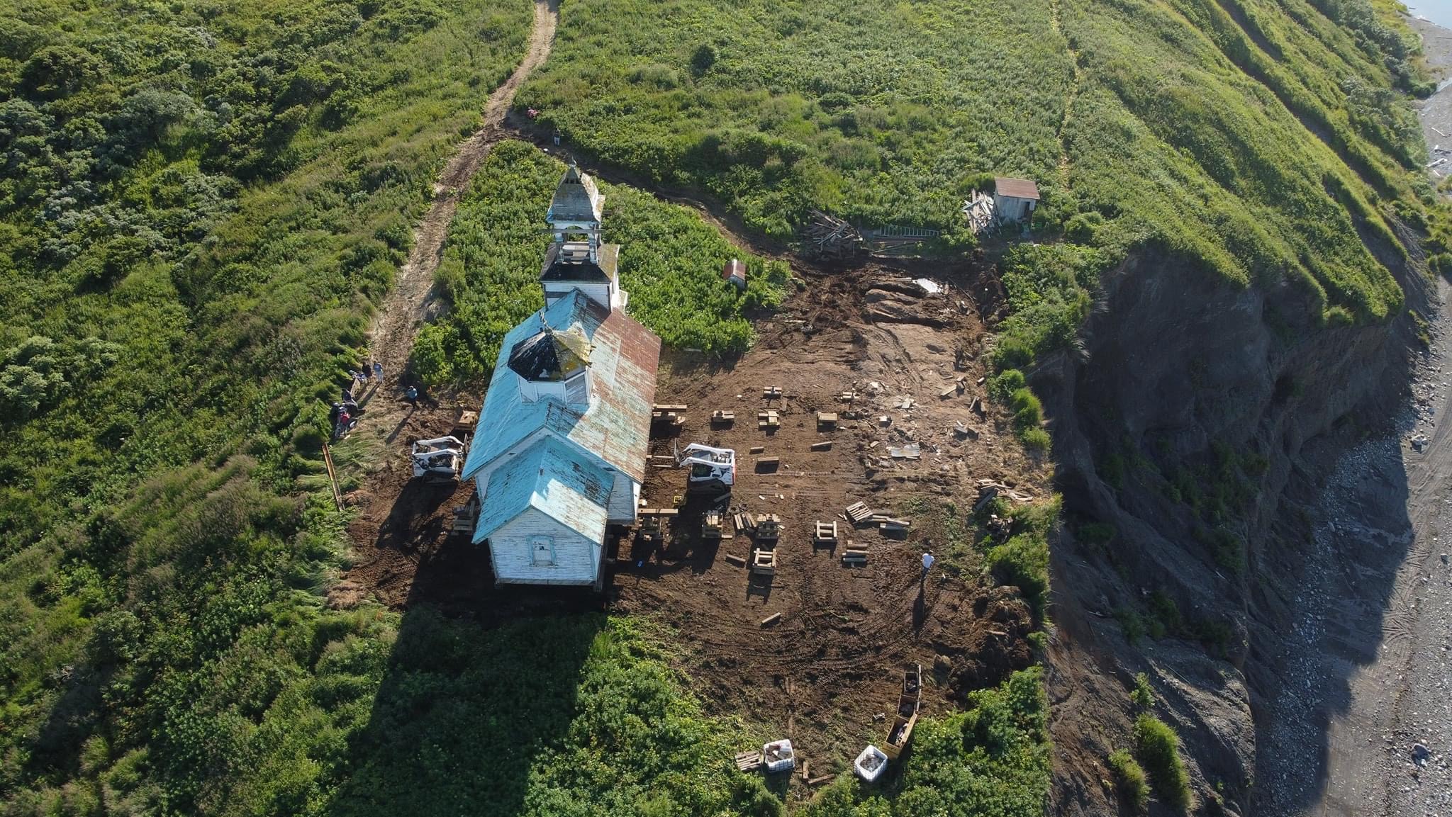 Church set back from cliff's edge, after the move.
