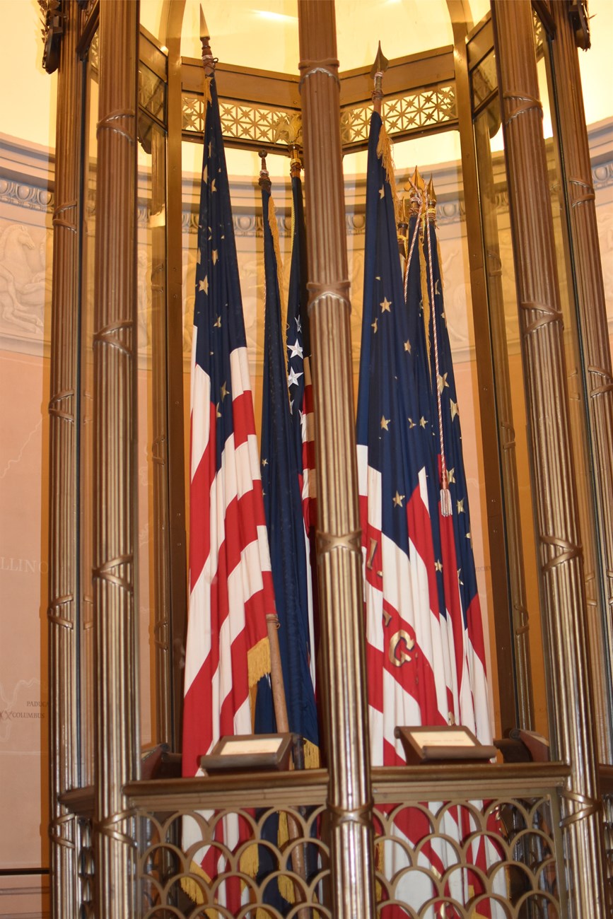 American flag located behind a glass display case