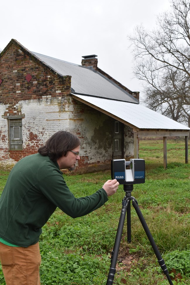 Jason Church setting up laser scanner at Magnolia Plantation.