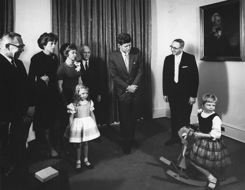 President Kennedy meets with the family of two children with disabilities.