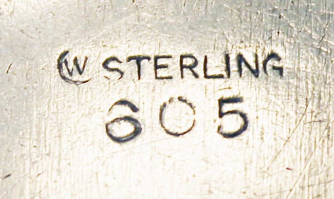 mark stamped on silver of W in crescent, STERLING, 605