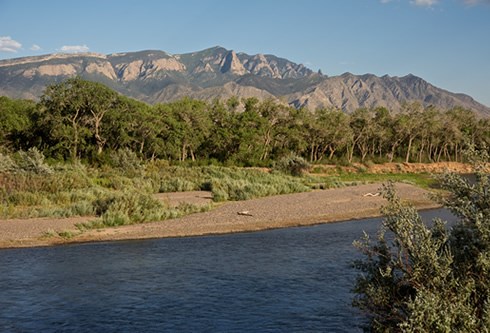 The Rio Grande bosque (woodlands) and the Sandia Mountains lie just beyond Kuaua Ruins, a precontact Tiwa village that was one of the largest Pueblo Indian settlements in the region at the time of the 1540 expedition of Francisco Vásquez de Coronado. Phot