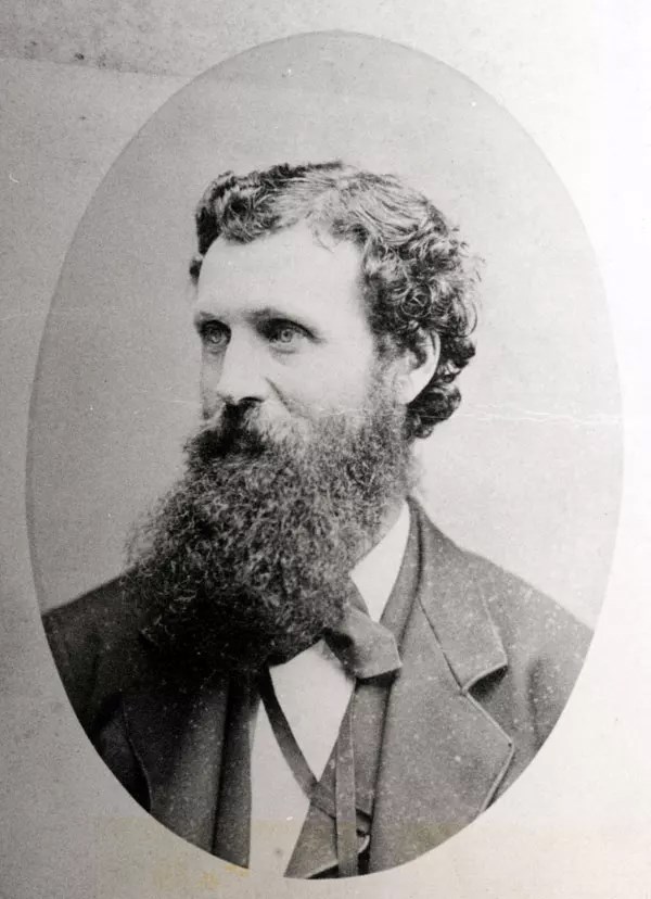 A vintage photo of a man with a long beard