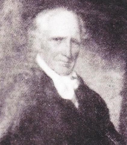 John Thomas Jr as an older man with graying hair.