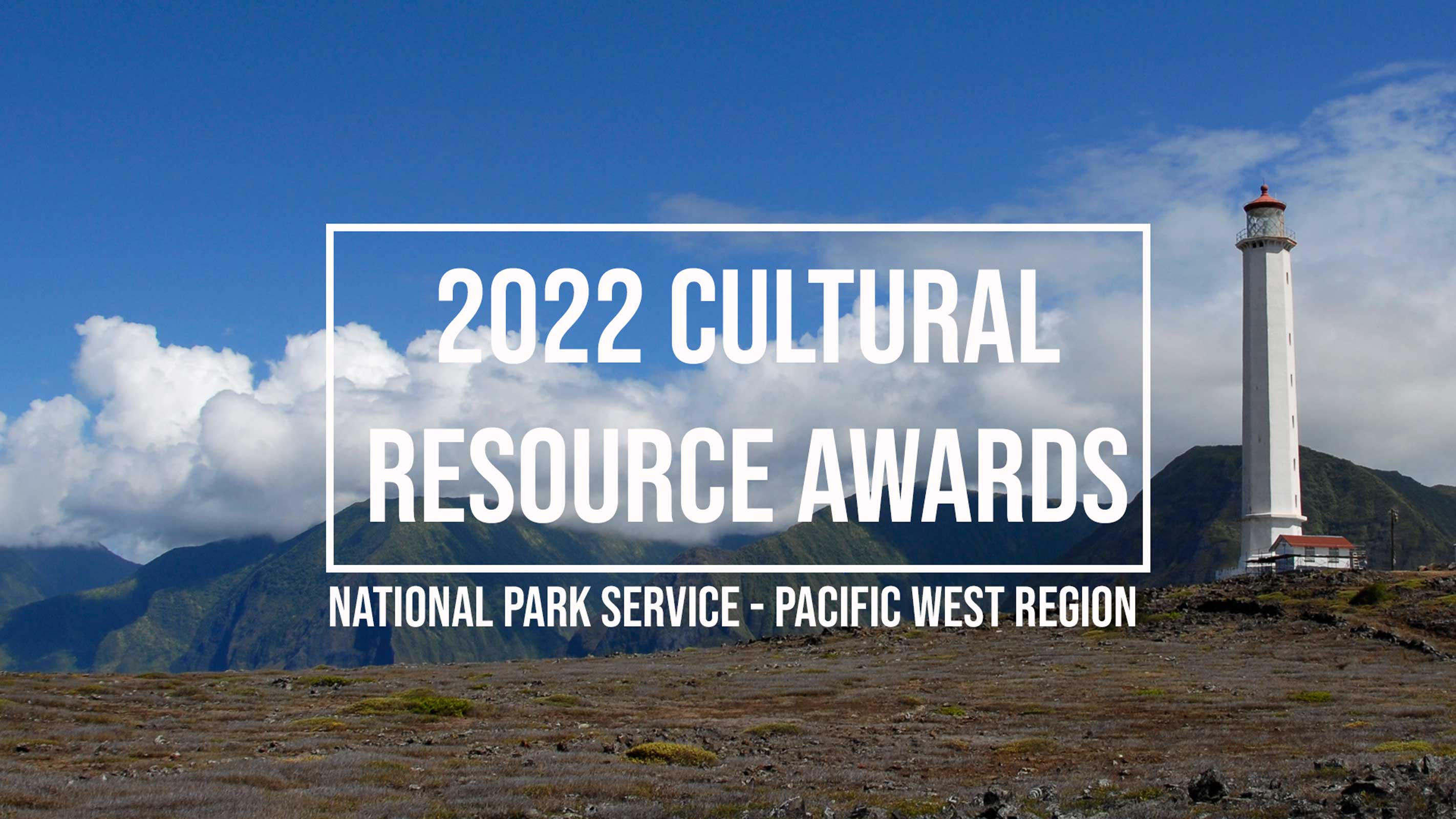 Tropical landscape with white lighthouse tower on right. In background, steep lush mountains capped with clouds. Reads “2022 Cultural Resource Awards. National Park Service. Pacific West Region.”