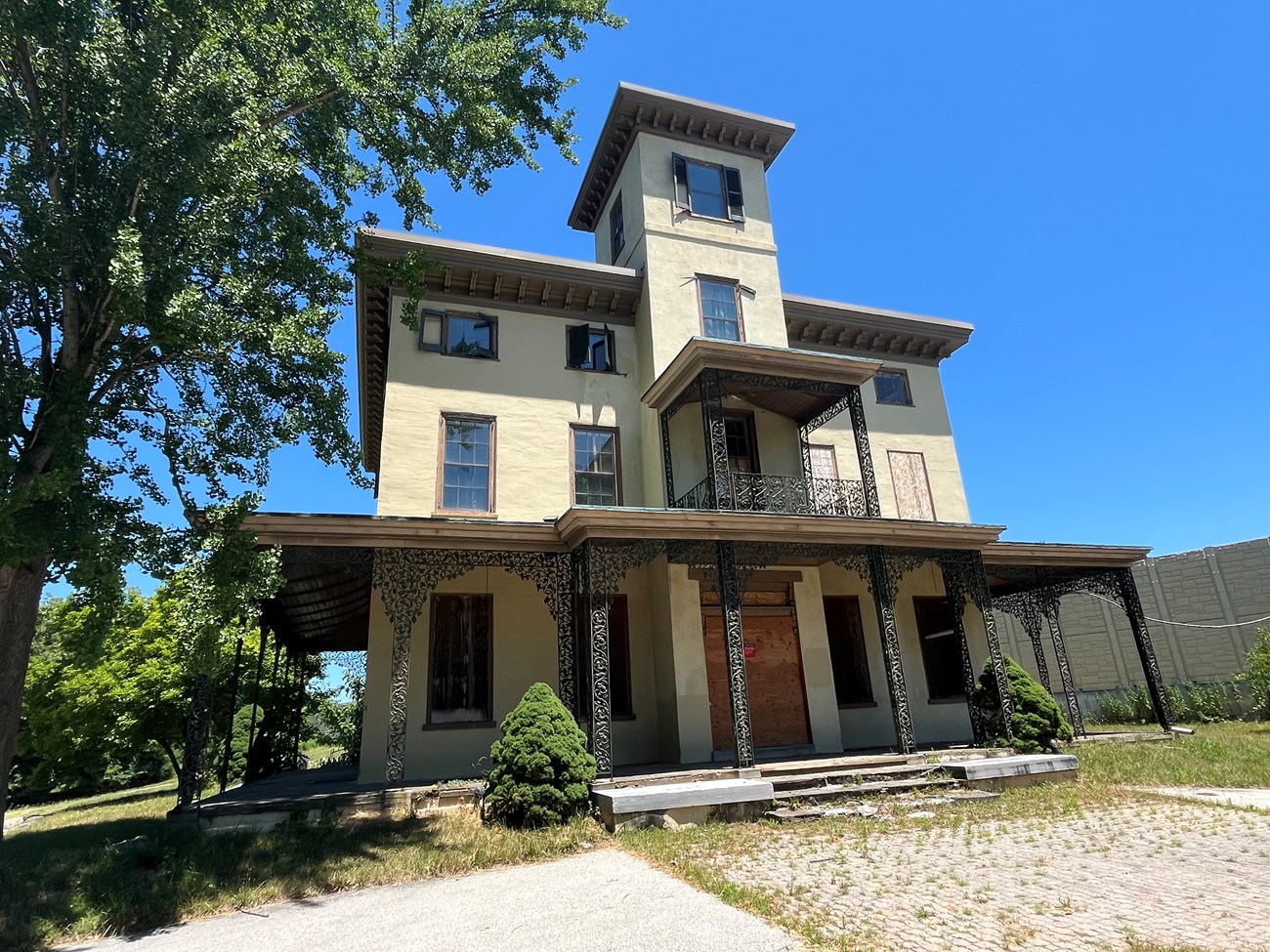 Color photograph of large mansion facade.