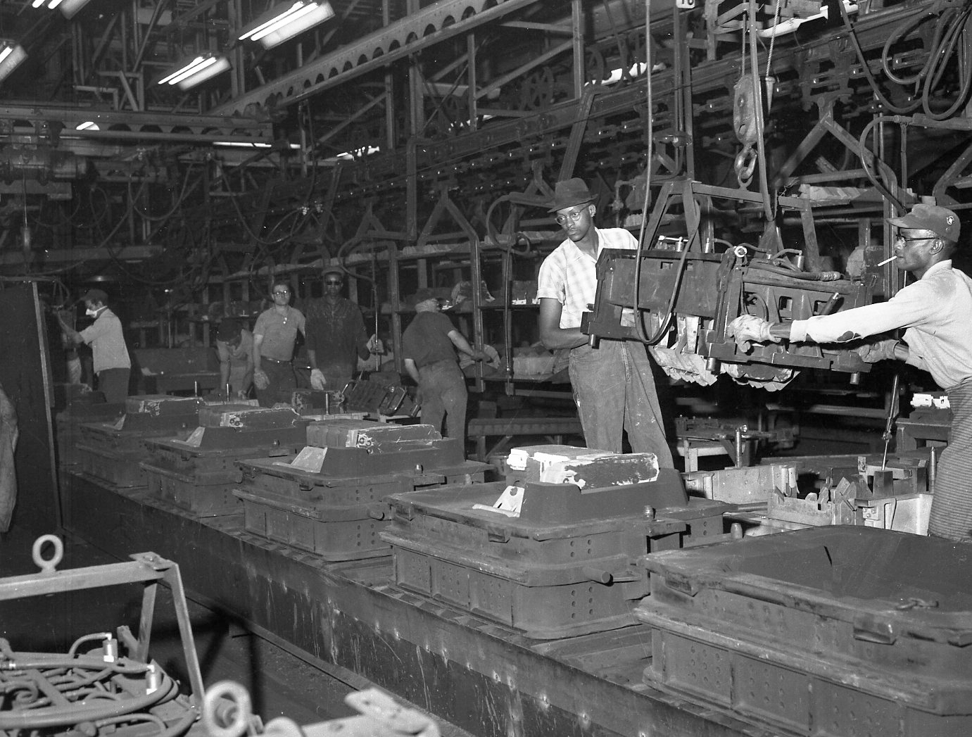 Men working on the Flint Buick assembly line