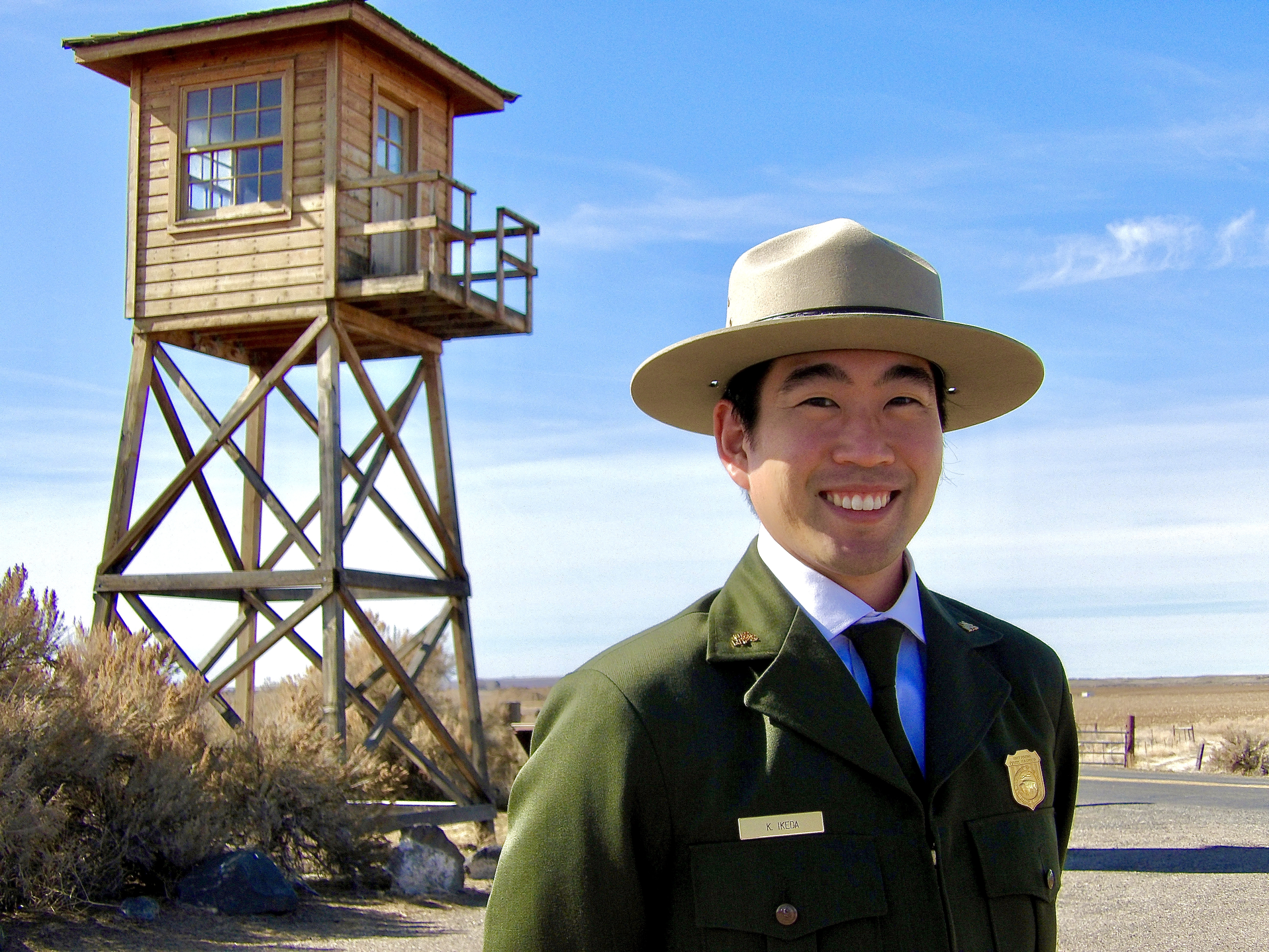 Kurt Ikeda in front of the guard tower at Minidoka National Historic State