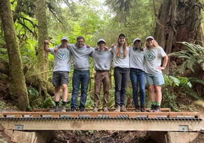 2024 Youth Conservation Crew standing on a bridge they help construct.