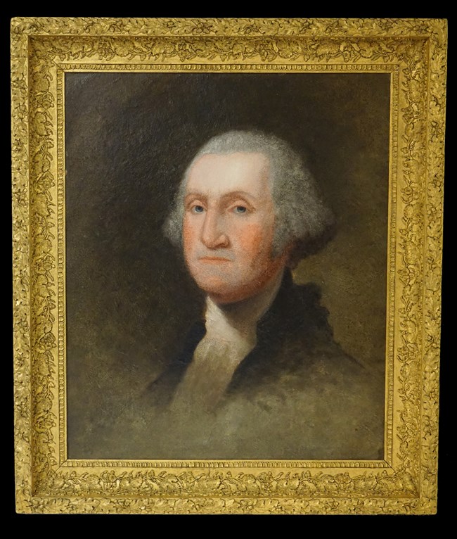 Painted portrait of George Washington in a gold frame