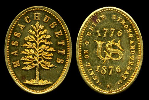Two sides of an oval gold medal with design of pine tree and US monogram