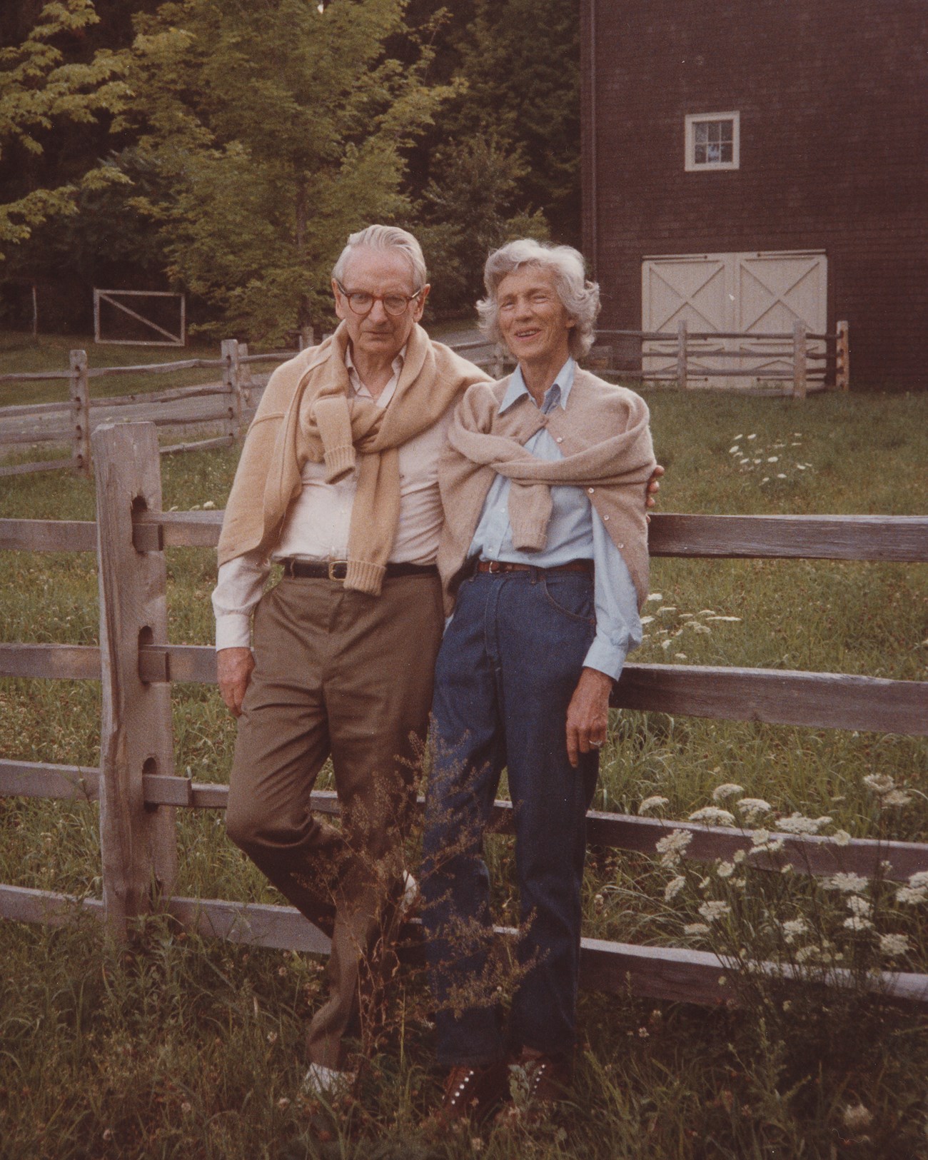 laurance and mary rockefeller in later years leaning on fence