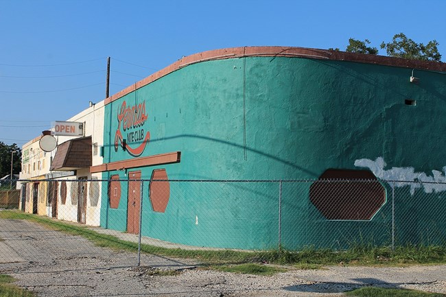 Side view of blue building with orange accents