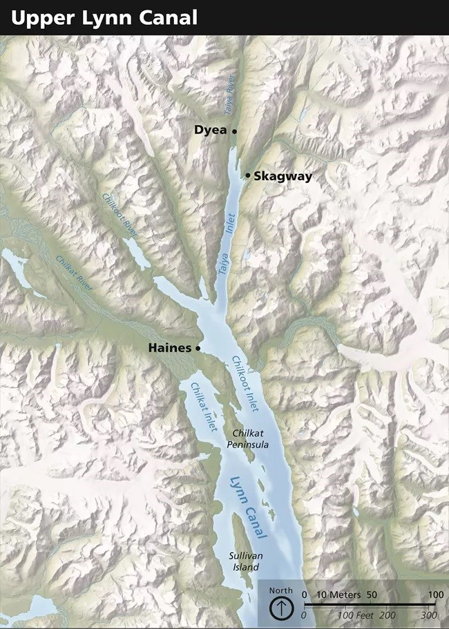 Color topographical map of the Lynn Canal in Alaska. The towns of Dyea and Skagway are marked with black dots.