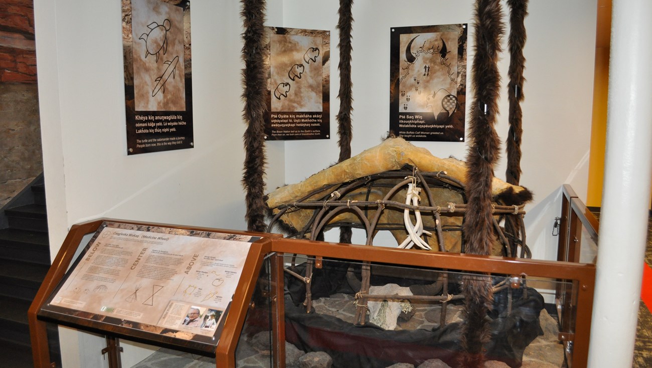 A sculpture interpretating the Lakota Emergence narrative in a visitor center.