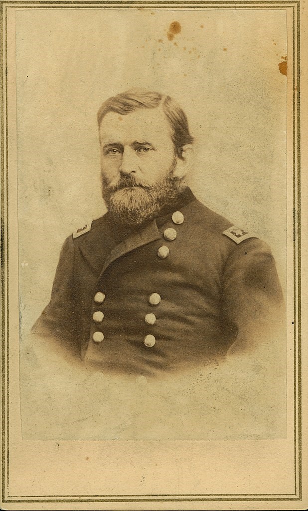 Bearded man wearing U.S. Army uniform and posing for a photo.