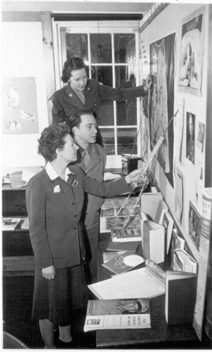 Mary with two other people at post library