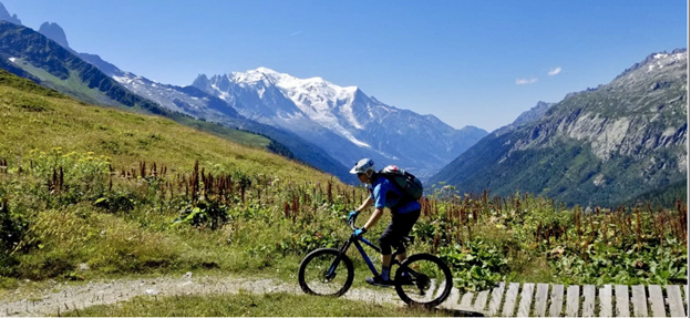 A person riding a bike on a mountain trail.