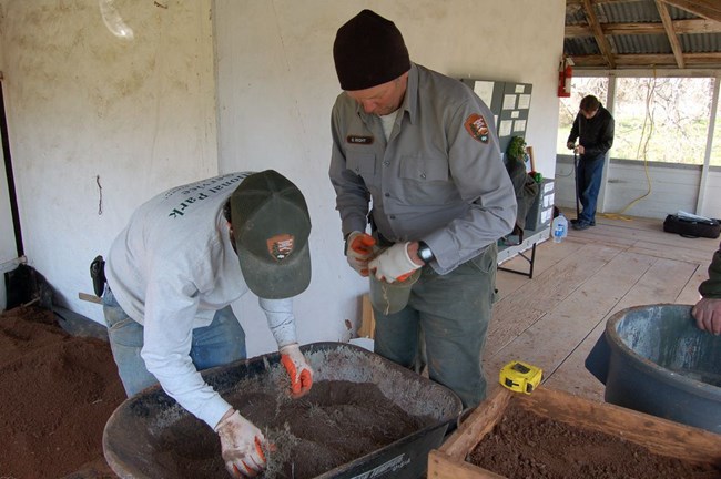 Moss Rudley and Bruce Wright dry mix the bouisillage.