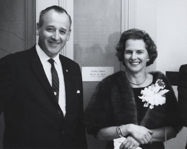 George and Helen Hartzog in formal clothes pose for a photo.