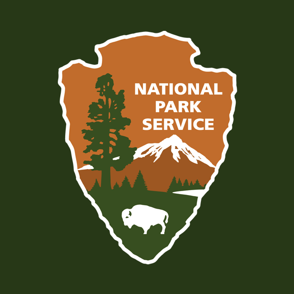 NPS arrowhead with dark green background