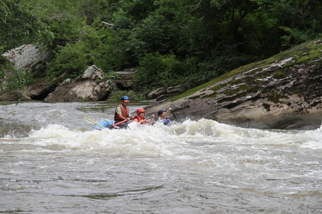 People in a raft on a whitewater river