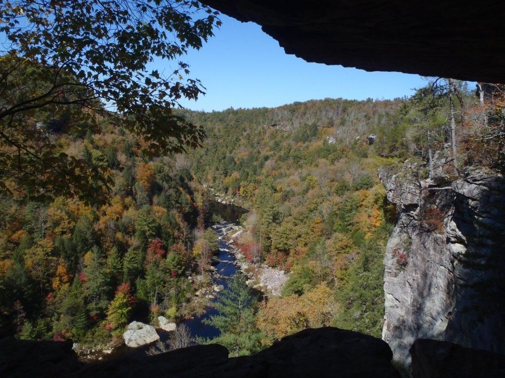 Rocky overlook with trees and river below