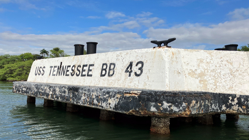 Before and after preservation work on F6N. After, the paint is uniform black and white and the anachronistic designation "USS Tennessee BB 43” is removed