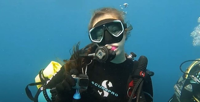 Underwater closeup view of a divers face
