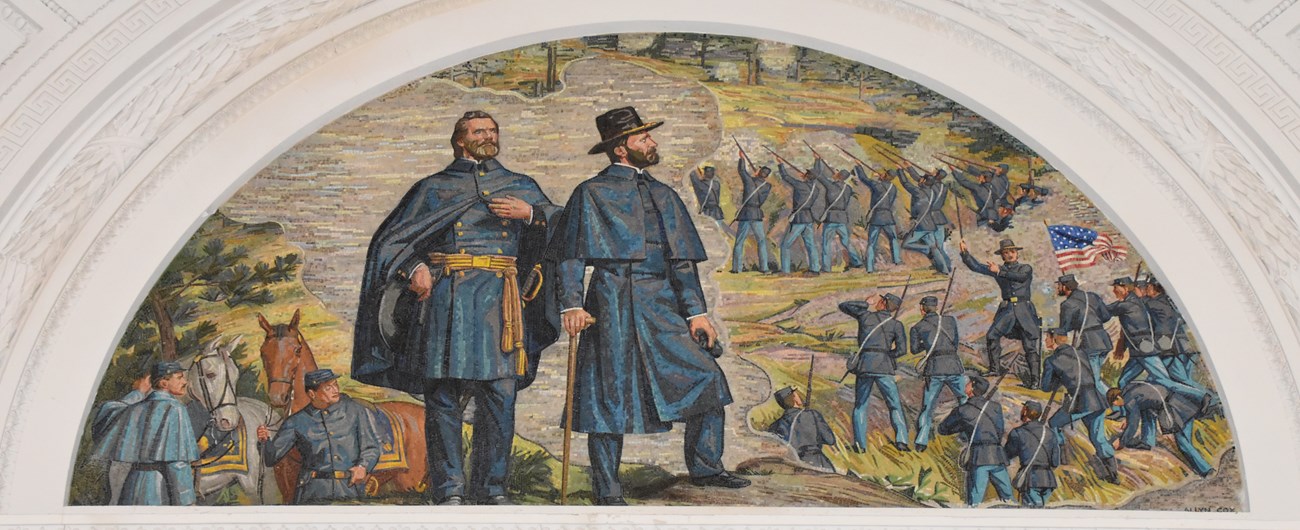 Mosaic art of two men in blue uniforms looking off into the distance, while in the background soldiers have their guns aimed up a large hill