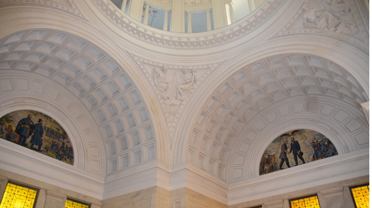 White round walls with different ornamental detail and a domed ceiling