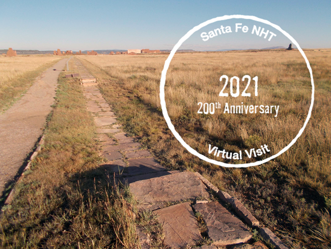 Ruts in a golden grassy field with a circular stamp on top of the image